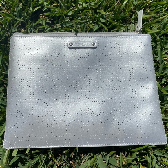 kate spade Handbags - Kate Spade Silver Perforated Cosmetic Bag
